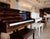 Piano showroom display of A+ grade refurbished pianos in a South King County boutique