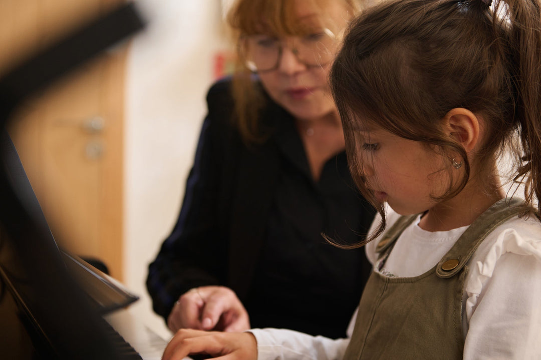 Piano students performing at a winter studio music event