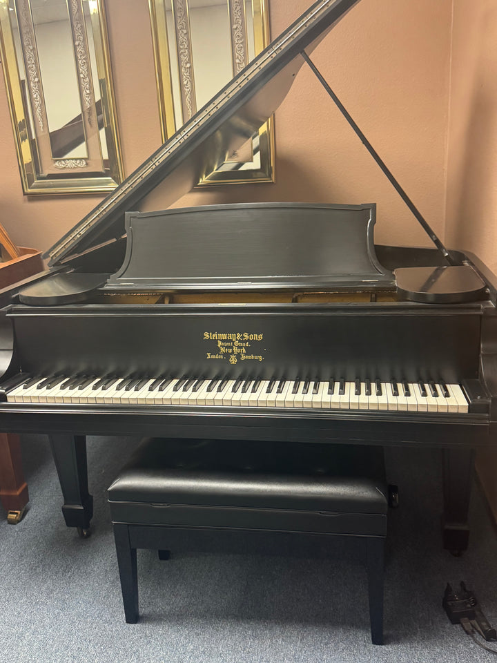 Restored Steinway Model M baby grand piano displayed in the Washington Pianos showroom