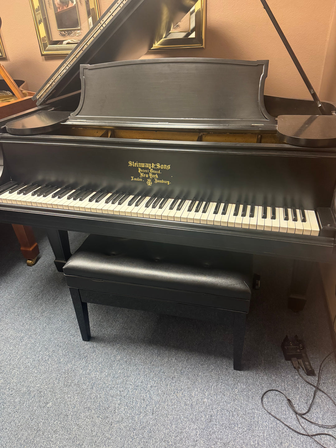 Steinway and Sons Model M baby grand piano in semi gloss ebony professionally restored and displayed at Washington Pianos