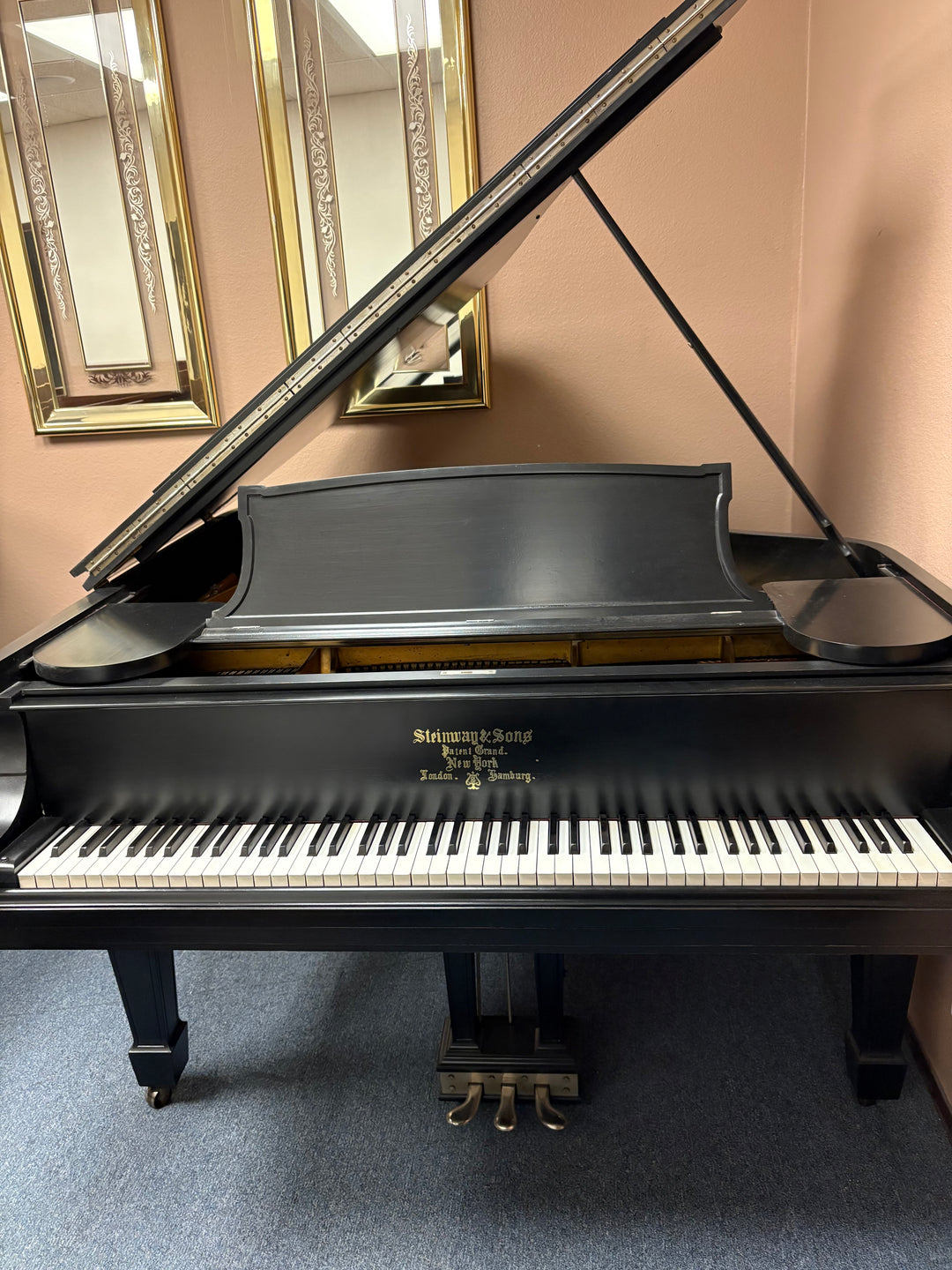Steinway Model M 5 foot 7 inch baby grand piano with semi gloss ebony finish professionally restored