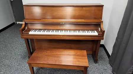 Yamaha Studio Piano Walnut Finish Front Facing Showroom